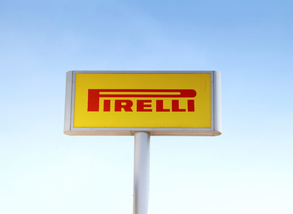 Large Pirelli sign on a stand, close-up.